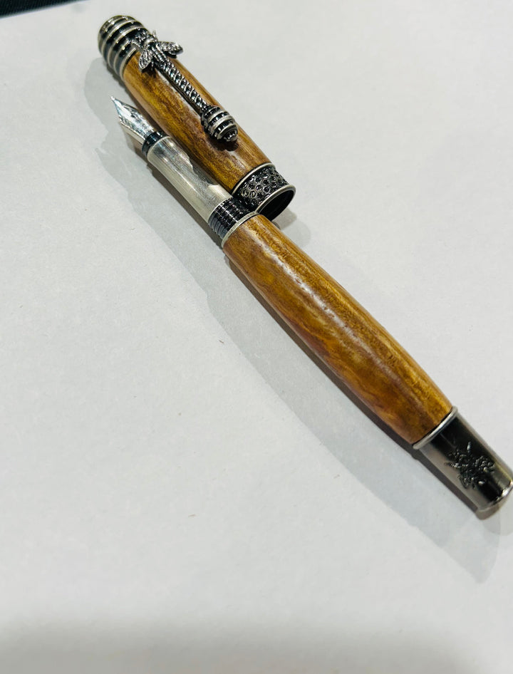 pecan wood hardware  A bee hive medium nib fountain pen with brush nickel metal hardware .And pecan wood.