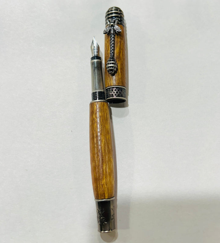 pecan wood hardware  A bee hive medium nib fountain pen with brush nickel metal hardware .And pecan wood.