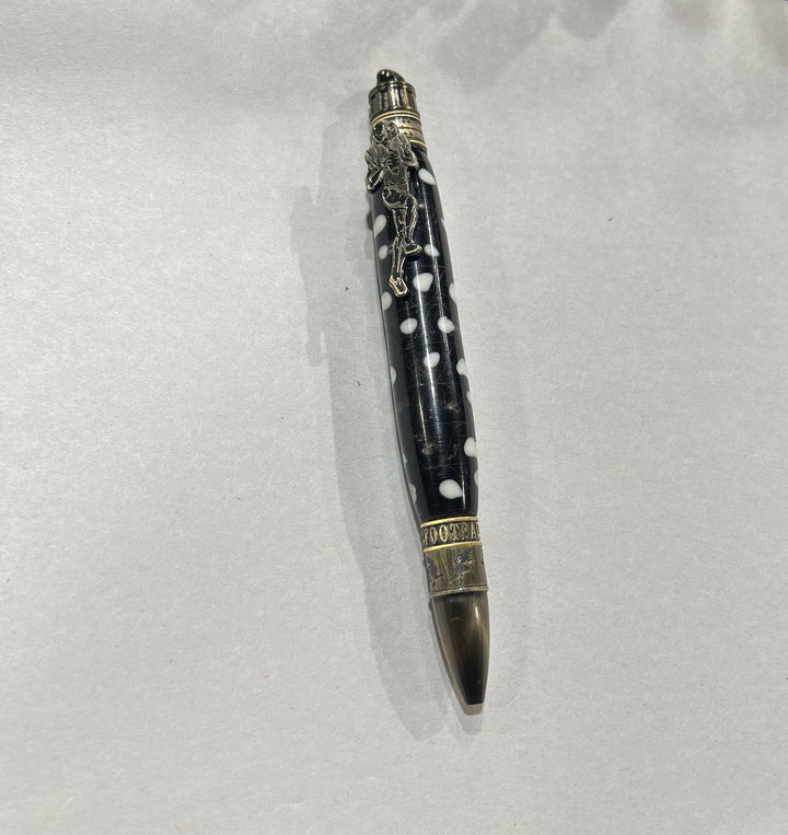 Ball point pen with a bronze metal love football live design, hardware . And a black and white acrylic . friction finish.