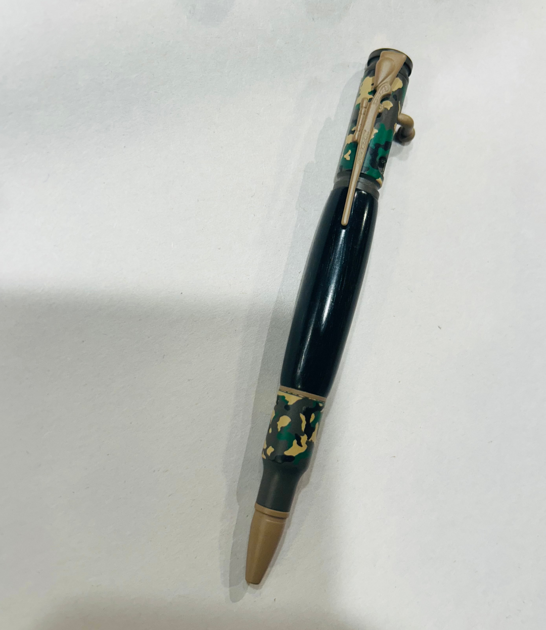 Ball point rifle pen with and camouflage painting  hardware . And with Blake Ebony wood. Friction finish.