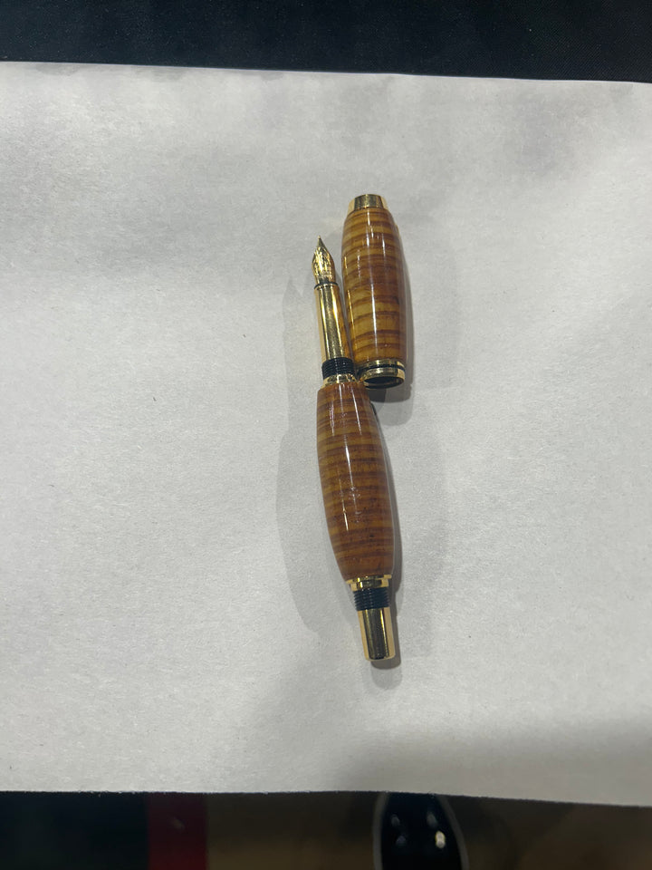 (Copy) (Copy) Fine point nib fountain pen with a gold metal hardware . And a in cheese wood burl strip design.and a CA finish.