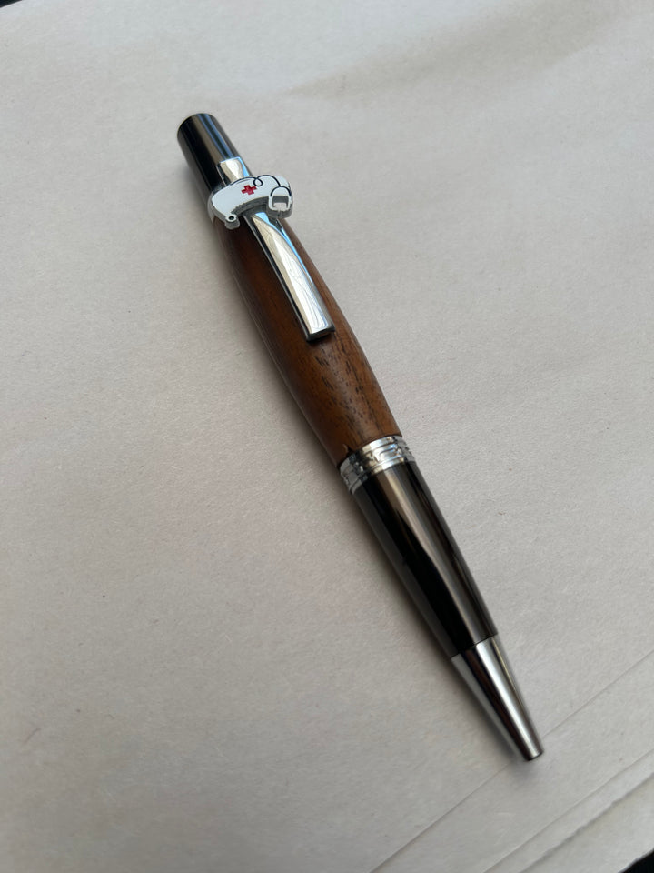 Ball point pen with silver and gun metal  hardware  with the nurse themed peace on it and stylus. And walnut wood. Friction polish.