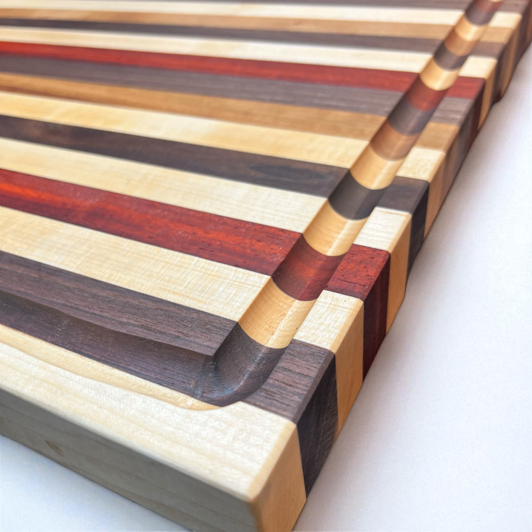 Edge Grain Walnut, Padauk, Maple, and Cherry Cutting Board